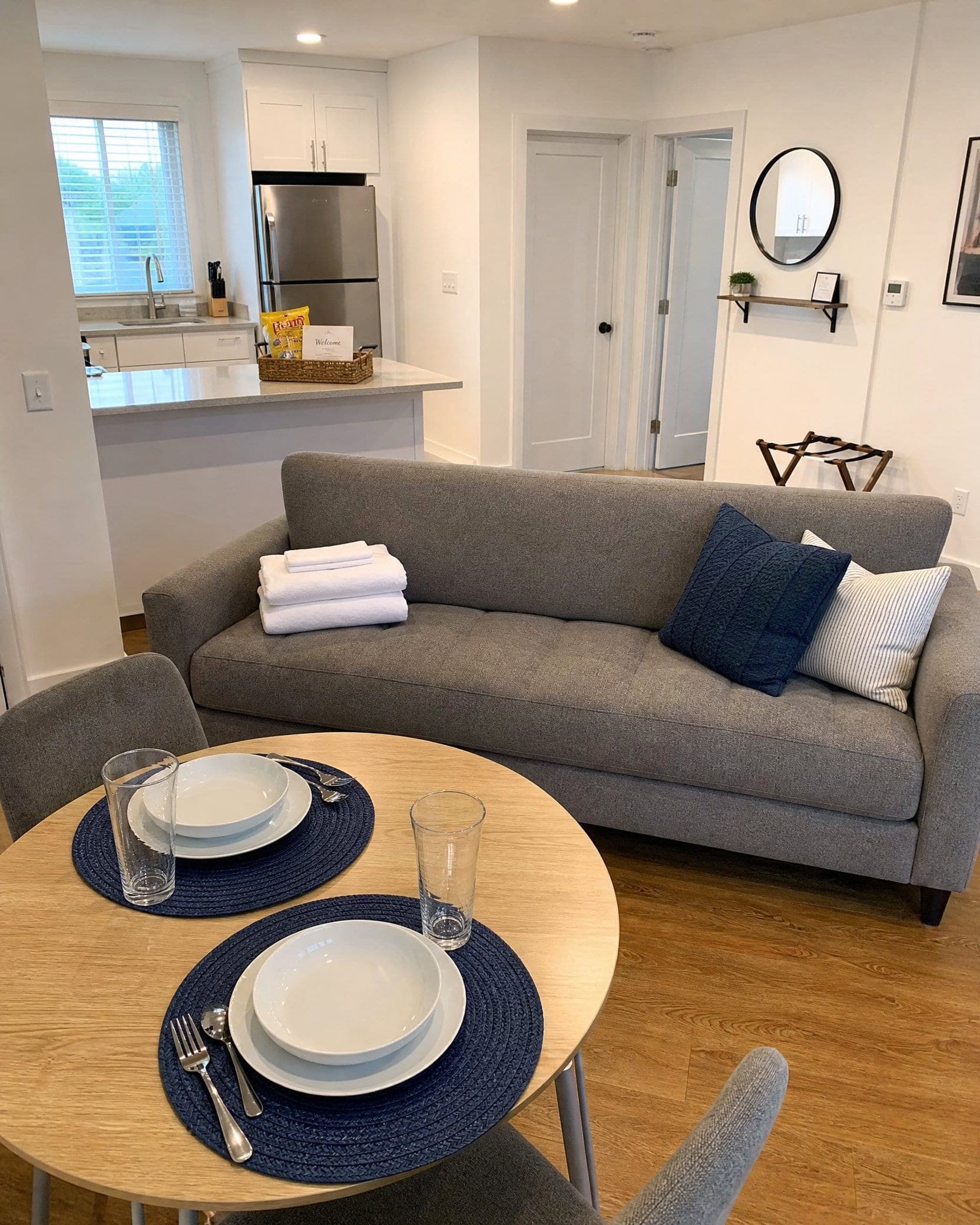 A rental unit set up for a new guest, with fresh towels and a welcome basket, after a NovaSpark turnover cleaning