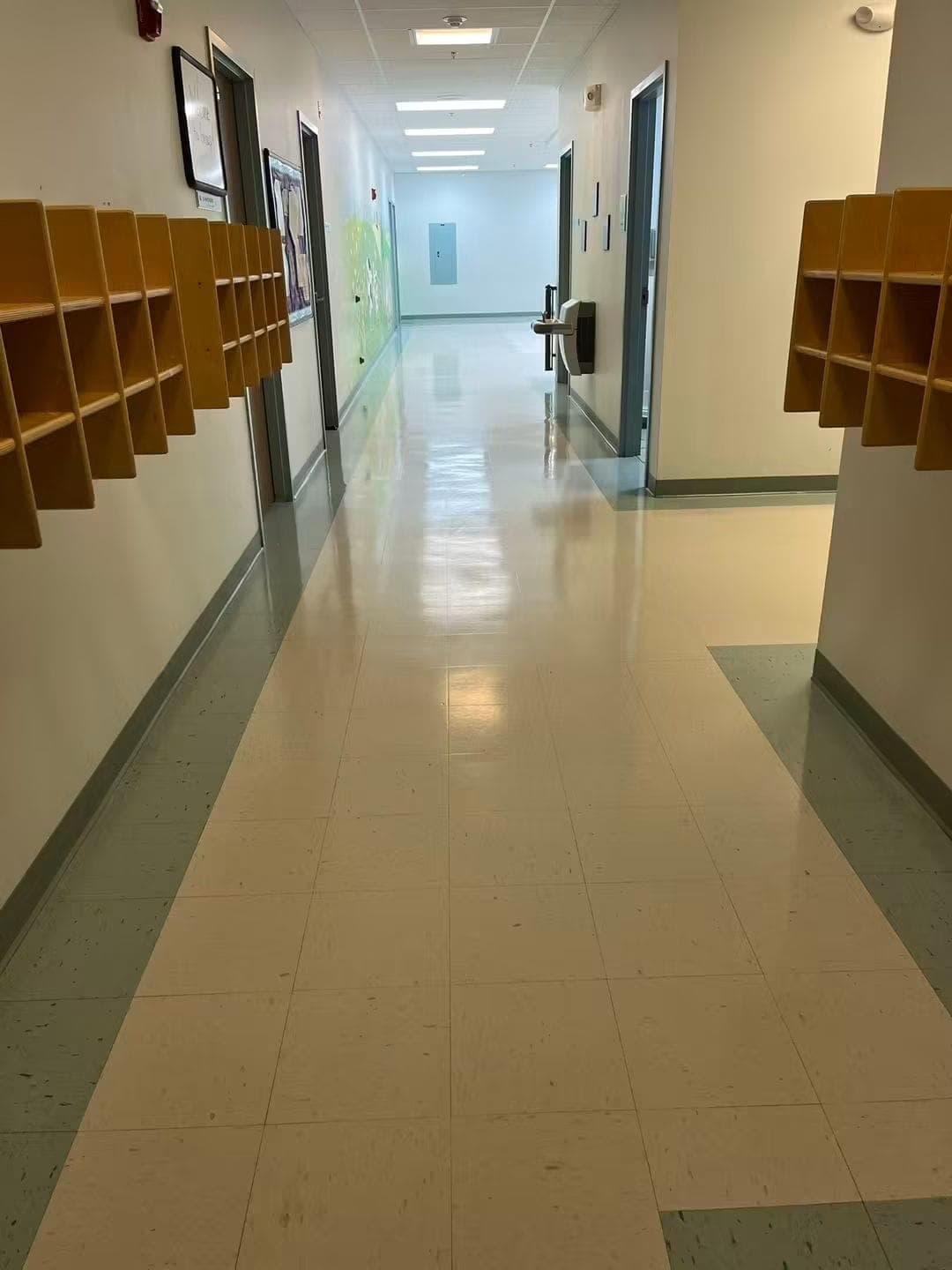 A hallway floor with a high-gloss finish after NovaSpark's strip-and-wax service