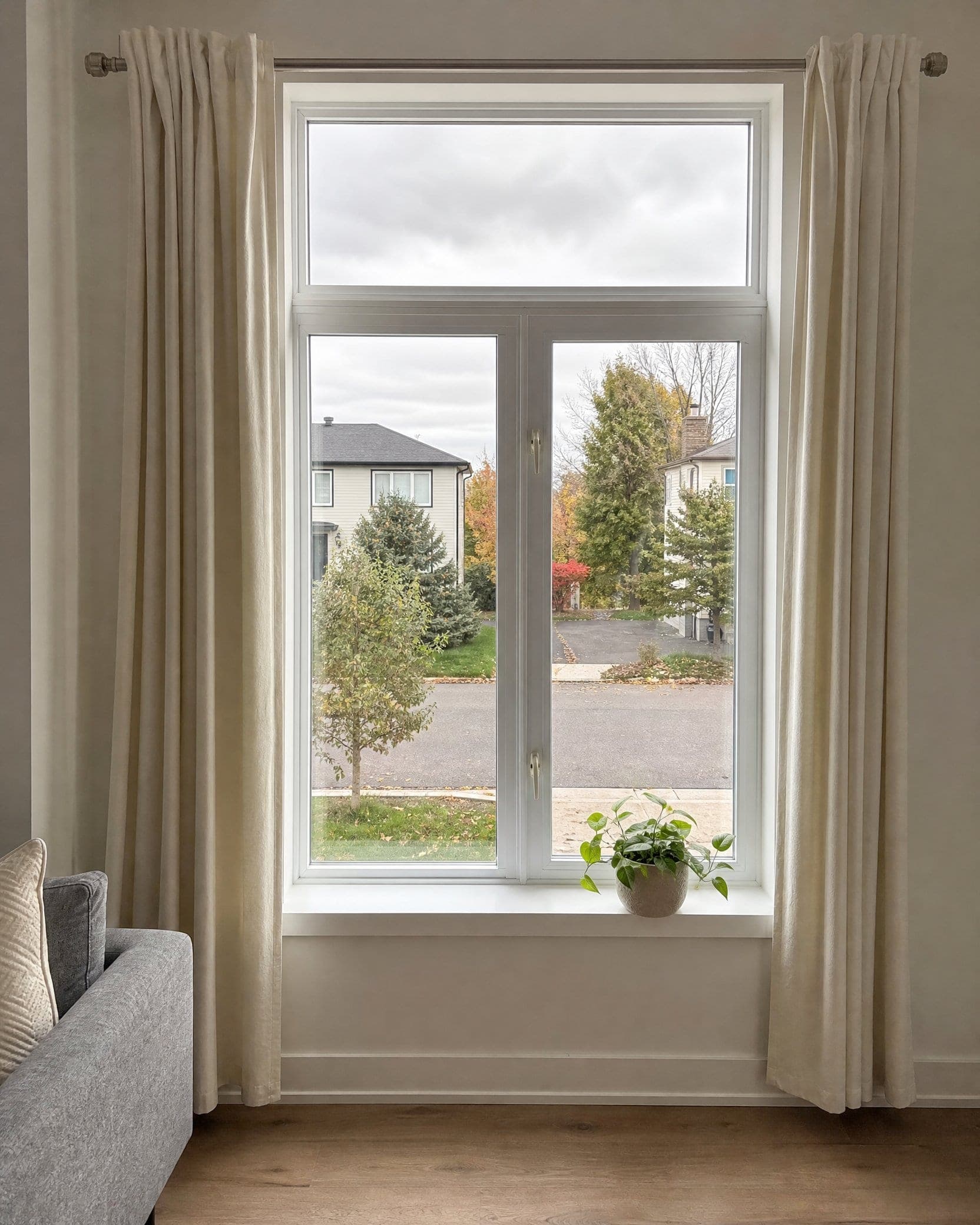 A window looking out over a Greater Boston neighborhood street